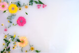 Flowers in bath water and copy space for text