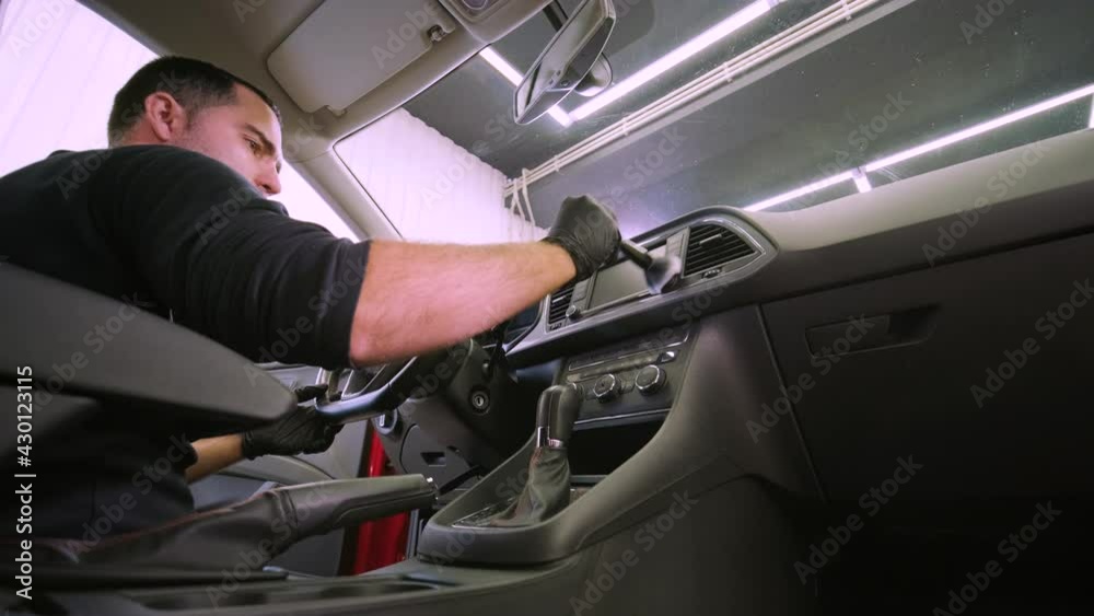 Professional car cleaning. Сar wash. Interior detailing. Dry clean and detail a car interior. Deep seats cleaning. Wiping foam in car wash. Cleaning the car panel from dust. A vacuum cleaner Professional car cleaning. Сar wash. Interior detailing. Dry clean and detail a car interior. Deep seats cleaning. Wiping foam in car wash. Cleaning the car panel from dust. A vacuum cleaner