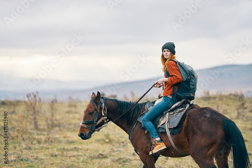 woman hiker riding horse travel mountains landscape © SHOTPRIME STUDIO