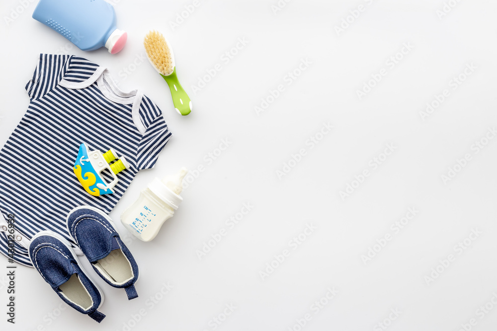 Bodysuit and shoes for baby boy. Baby shower. Top view Bodysuit and shoes for baby boy. Baby shower. Top view