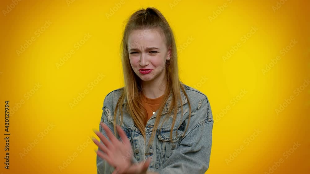 How could you. Upset girl cries, raising hands in indignant expression, asking why what reason of failure, demonstrating disbelief irritation by troubles. Young adult woman on yellow background