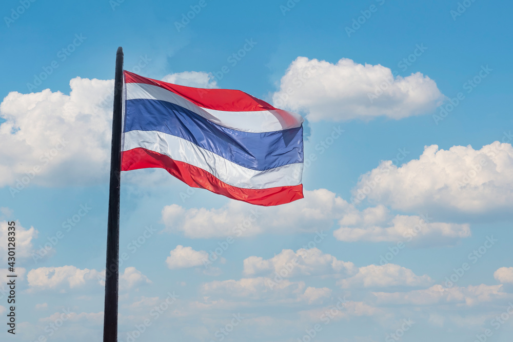 Thailand flag waving against blue sky background