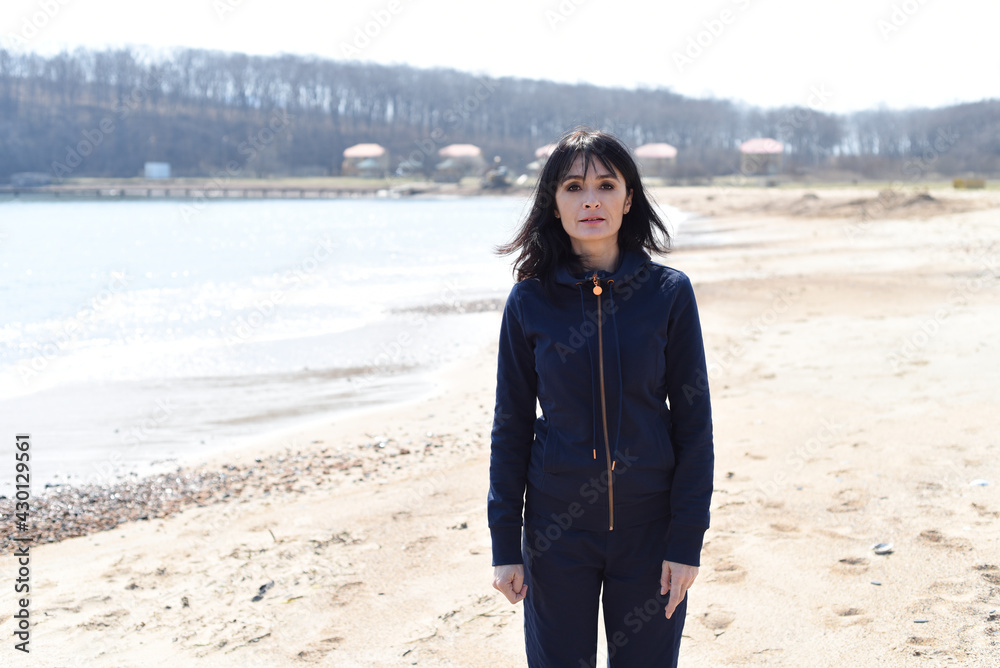 45 y.o. Russian woman looking at camera. Japanese sea beach 45 y.o. Russian woman looking at camera. Japanese sea beach
