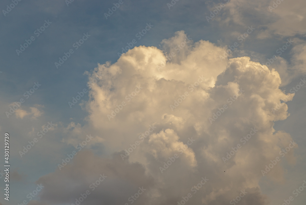 The cloudy beautiful sky with the light shining from the sun at afternoon. The softness of the cloud creates a feeling of relaxation. copy space, No focus, specifically. The cloudy beautiful sky with the light shining from the sun at afternoon. The softness of the cloud creates a feeling of relaxation. copy space, No focus, specifically.