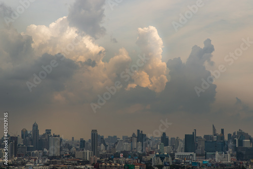 Bangkok, Thailand - Apr 16, 2021 : Beautiful sky and cloud view of Bangkok with skyscrapers in the business district in the afternoon. Selective focus. © num