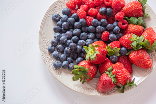 fresh ripe juicy wild berries raspberries and blueberries 