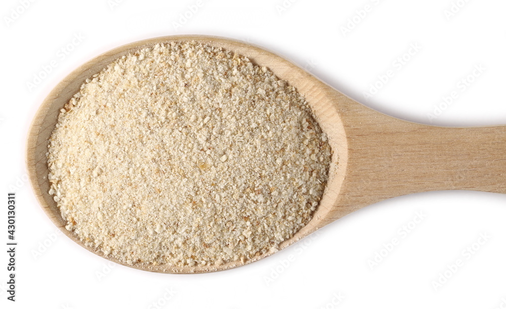 Ground bread crumbs pile in wooden spoon isolated on white background, top view Ground bread crumbs pile in wooden spoon isolated on white background, top view