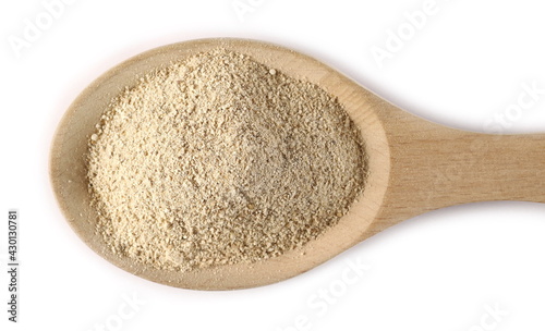 Milled Shiitake mushroom powder (Sh) in wooden spoon isolated on white background
