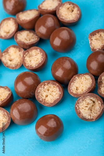 Chocolate candy balls and halves with crisp filling