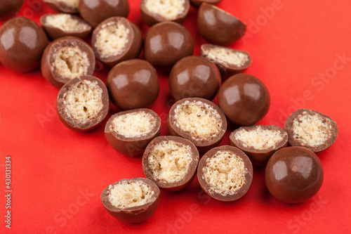Chocolate candy balls and halves with crisp filling