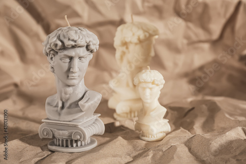 Beautiful David bust candles on crumpled paper