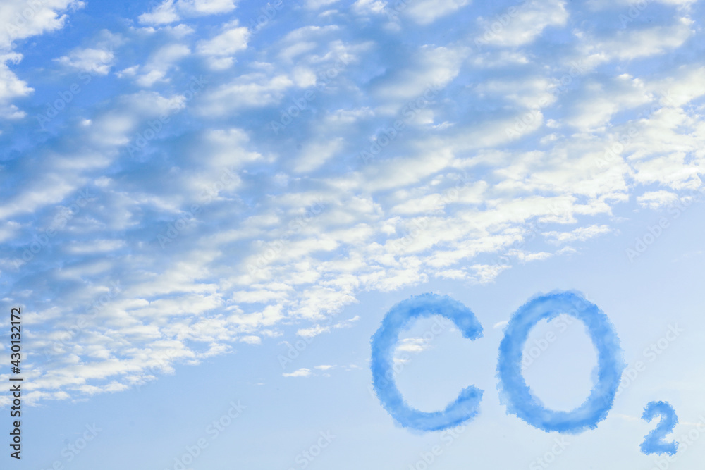 Naklejka premium CO2 emissions. View of blue sky with white clouds