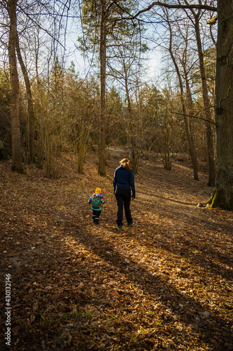 mother and son out walking in the woods