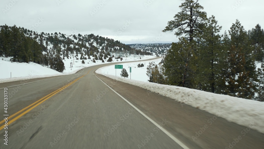 Road trip in USA from Zion to Bryce Canyon, driving auto in Utah. Hitchhiking traveling in America, Route 89 to Dixie Forest. Winter local journey, calm atmosphere and snow mountains. View from car. Road trip in USA from Zion to Bryce Canyon, driving auto in Utah. Hitchhiking traveling in America, Route 89 to Dixie Forest. Winter local journey, calm atmosphere and snow mountains. View from car.