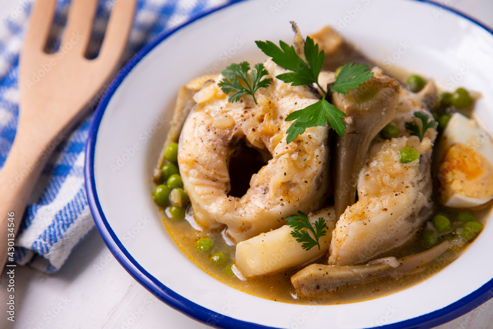 Conger eel with artichokes and white asparagus. Typical Spanish coast dish. Conger eel with artichokes and white asparagus. Typical Spanish coast dish.