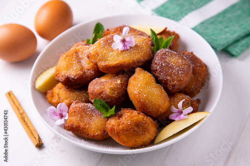 Fried buñuelos with ricotta cheese and apple.