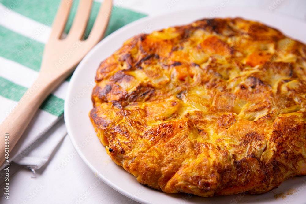 Spanish omelette with cheese, potatoes and sweet potato