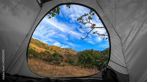 View from inside of hikers tourist tent in mountains. Location of antique Greek city of Knidos, Turkey
