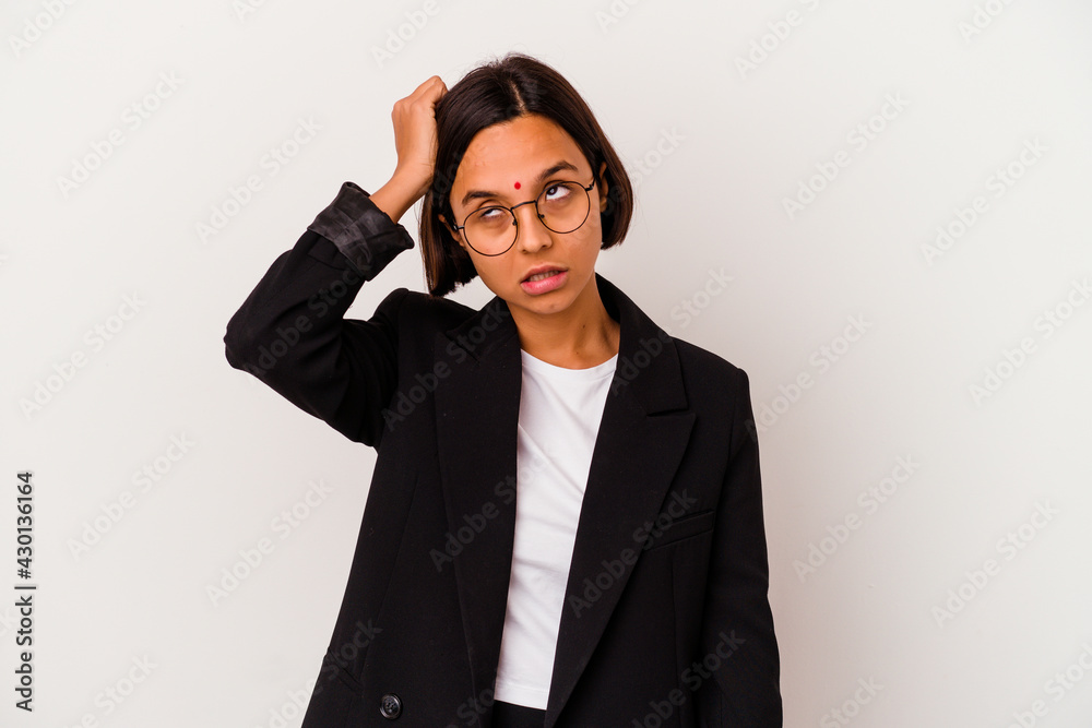Young business Indian woman isolated on white background tired and very sleepy keeping hand on head. Young business Indian woman isolated on white background tired and very sleepy keeping hand on head.