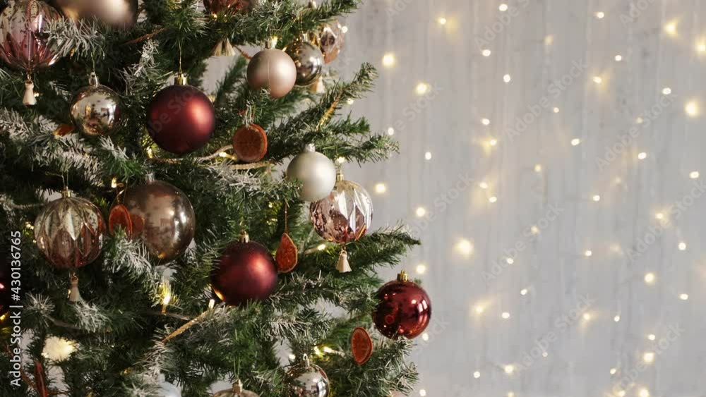 close up of decorated christmas tree, copy space over festive lights background close up of decorated christmas tree, copy space over festive lights background