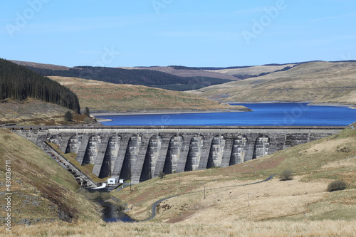 The wall across Nant-y-moch Reservoir, used for hydro-electricity, in Ceredigion, Wales, UK.