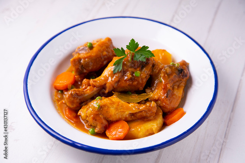 Chicken with potatoes and vegetables. Traditional tapa spanish recipe.