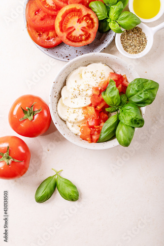 Mozzarella salad over white texture background
