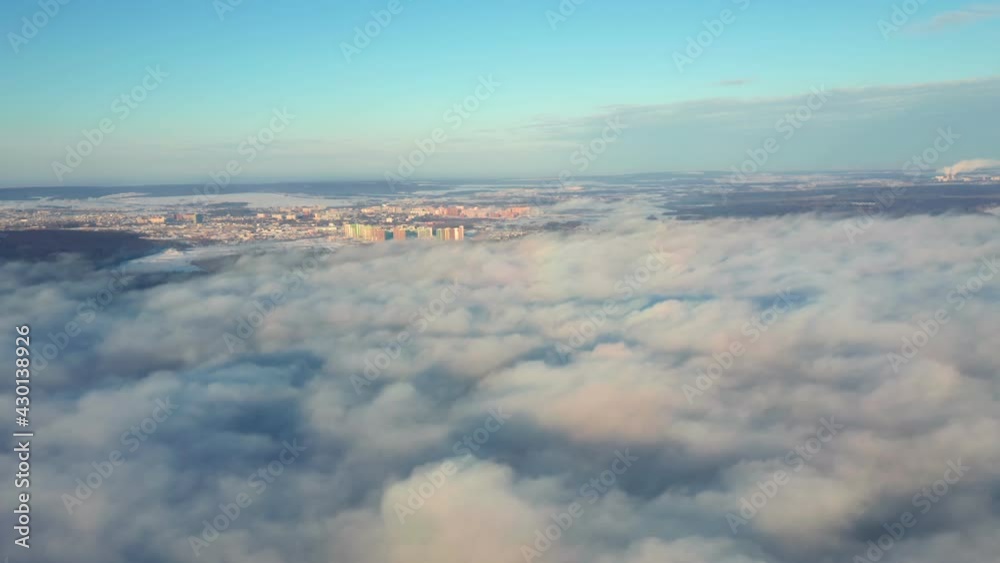 Aerial view landscape of city, bright blue sky in the background. Sunrise with many white clouds. Amazing fluffy clouds moving on the sky. High quality. 4k footage. Aerial view landscape of city, bright blue sky in the background. Sunrise with many white clouds. Amazing fluffy clouds moving on the sky. High quality. 4k footage.
