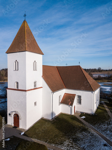 Aerial view of Alsunga catholic chursh in winter, Latvia.  photo