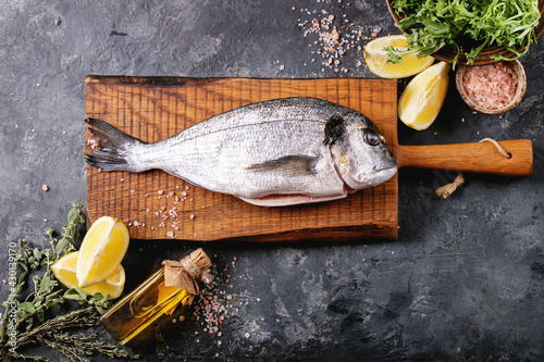 Raw uncooked fresh gutted sea bream or dorado fish