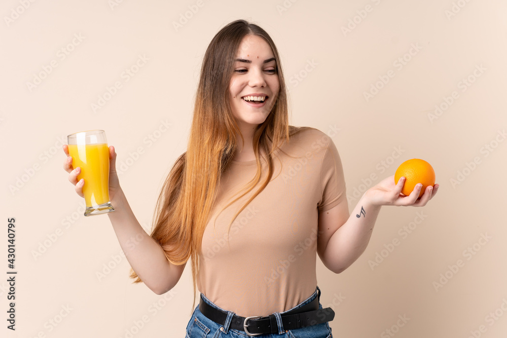 Young caucasian woman holding an orange Young caucasian woman holding an orange