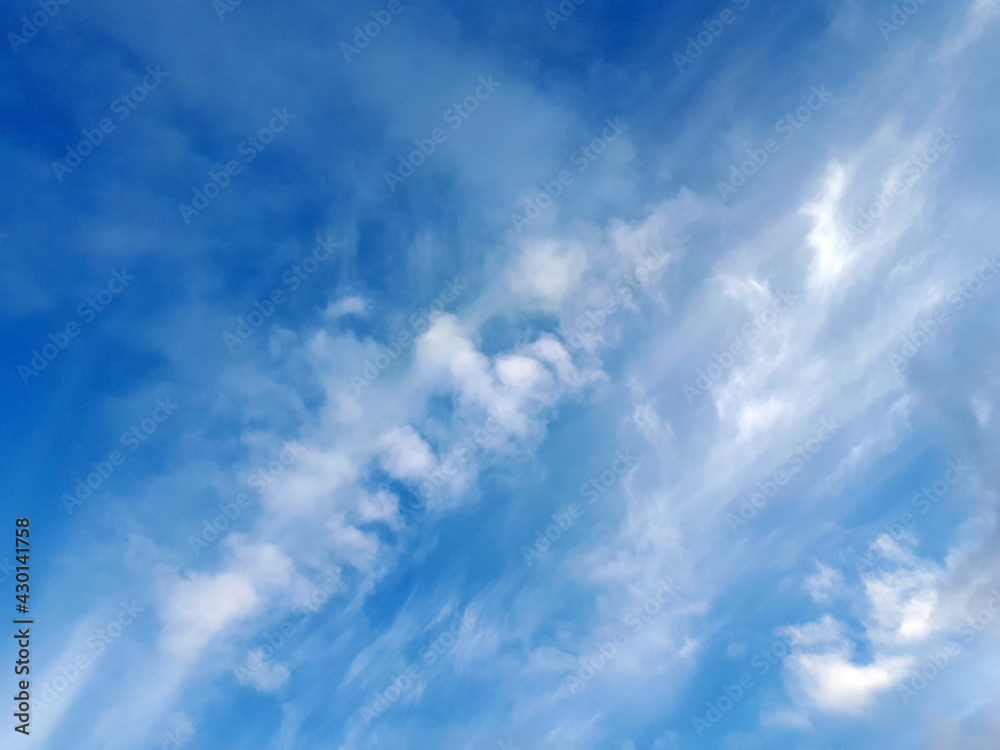 Blue sky with fluffy white clouds, can be used as background for your artwork Blue sky with fluffy white clouds, can be used as background for your artwork