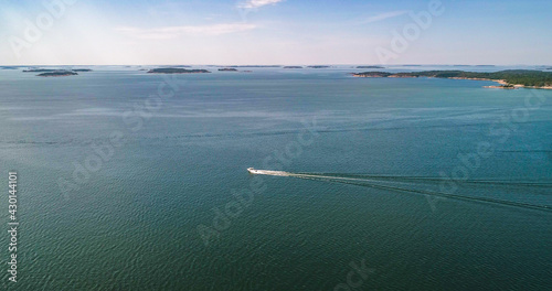 Boat driving in middle of a islands 01 photo