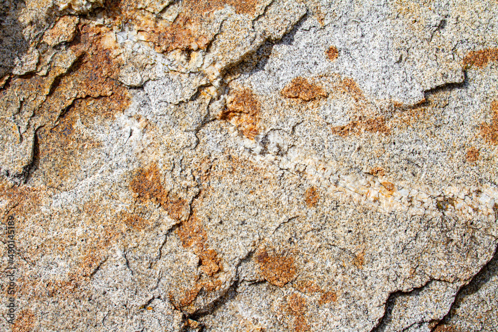 Natural colorful stone texture surface in relief, brown and grey rock background Natural colorful stone texture surface in relief, brown and grey rock background