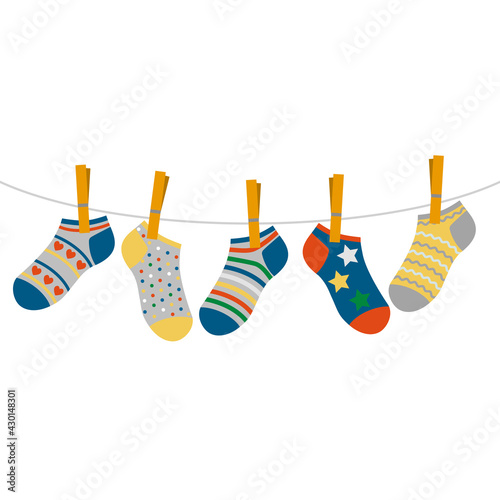 children's colored socks hang on a rope. concept of international day of children with down syndrome and premature babies