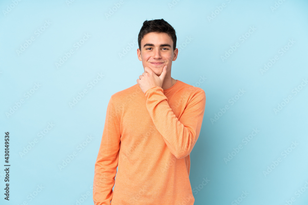 Teenager caucasian handsome man isolated on purple background laughing Teenager caucasian handsome man isolated on purple background laughing