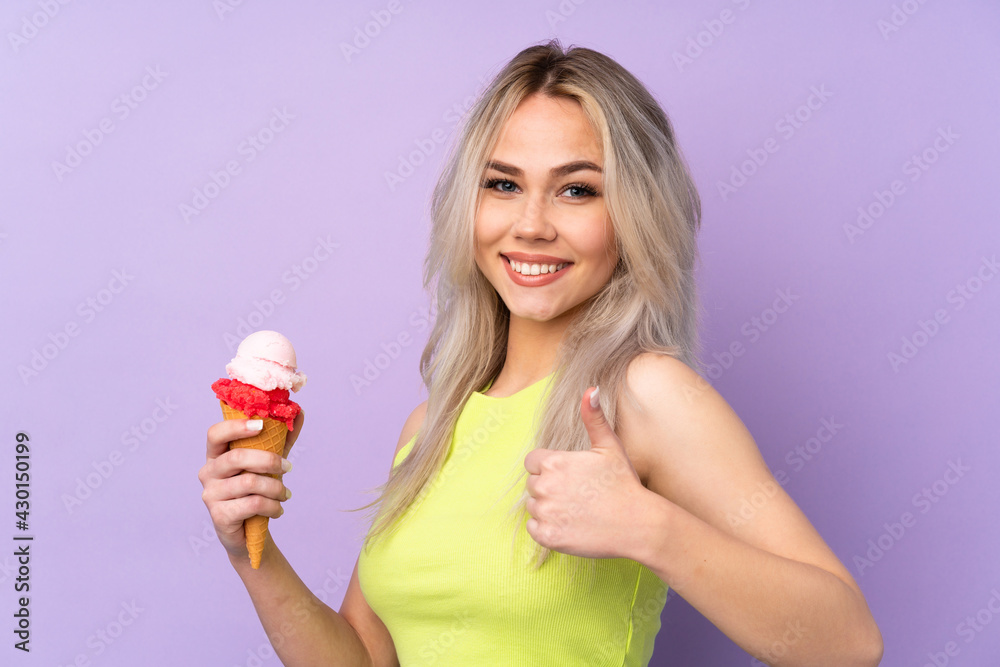 Teenager girl over isolated purple background with thumbs up because something good has happened Teenager girl over isolated purple background with thumbs up because something good has happened