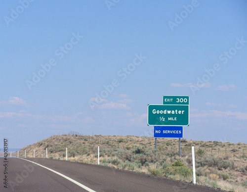 Directional sign on the road in Arizona with distance information to the Goodwater.