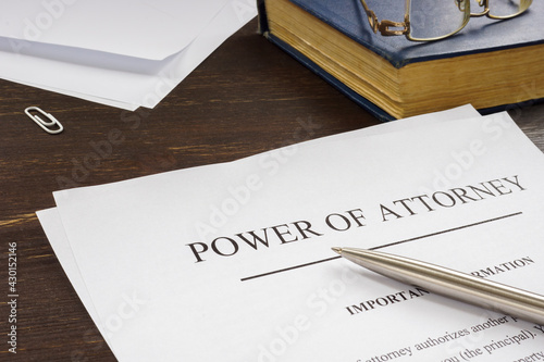 Power of attorney POA legal document and pen. photo