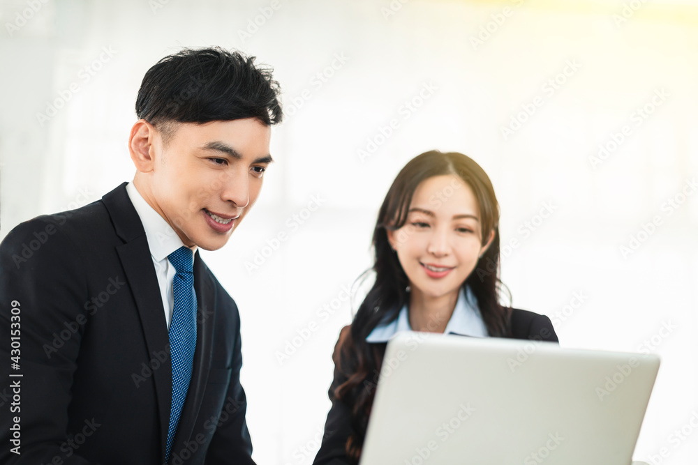 Business man and woman working together in office Business man and woman working together in office
