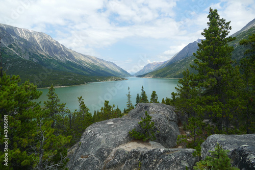 Bennett Lake with boreal forest and mountains landscape, British Columbia, Canada near Chilkoot Pass, famous historic gold rush route photo