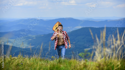 Music Station. sexy man with guitar in checkered shirt. hipster fashion. western camping and hiking. happy and free. cowboy man with bare muscular torso. acoustic guitar player. country music song