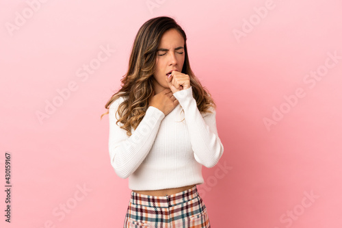 Young woman over isolated background coughing a lot