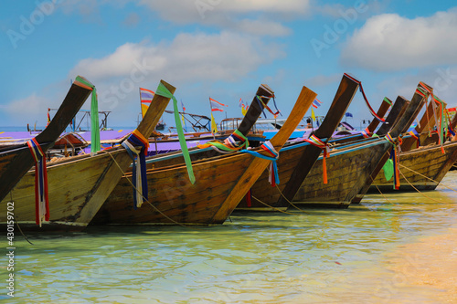 Tropical beach with traditional long tail boats on Kho Poda, Krabi, Thailand