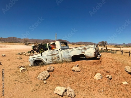 Old car wreck at Solitaire petrol station in the middle of nowhere in Namib Desert in Namibia
