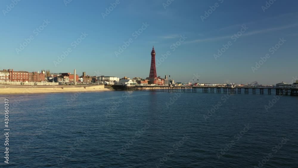4K: Aerial Drone Video of The Blackpool Tower, England, UK. Flying low over the sea towards the pier. Stock Video Clip Footage 4K: Aerial Drone Video of The Blackpool Tower, England, UK. Flying low over the sea towards the pier. Stock Video Clip Footage