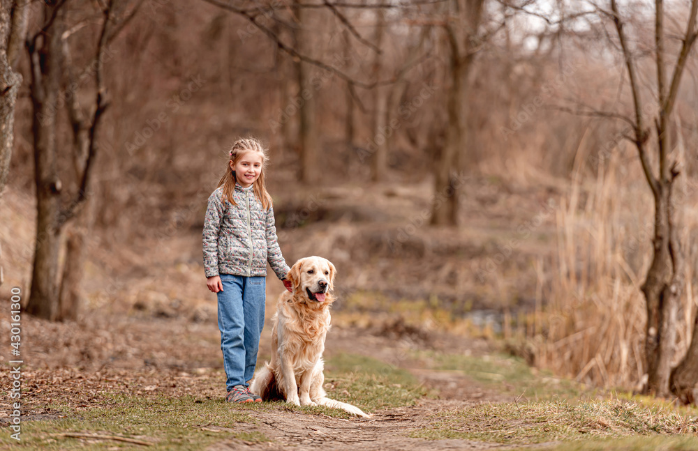 Preteen girl with golden retriever dog Preteen girl with golden retriever dog