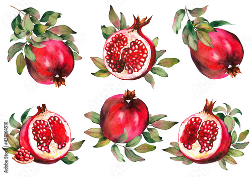 Set of red pomegranate fruits with green leaves. photo
