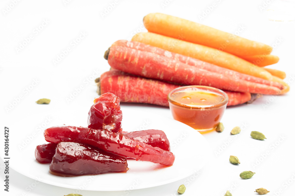 Ayurvedic Gajar Ka Murabba Or Gazar Murba Is Carrot Jam Made Of Carrots, Sugar Syrup And Bee Honey Shahad Madhu. It Can Be Preserved And Stored. Isolated On White Background With Copy Space Ayurvedic Gajar Ka Murabba Or Gazar Murba Is Carrot Jam Made Of Carrots, Sugar Syrup And Bee Honey Shahad Madhu. It Can Be Preserved And Stored. Isolated On White Background With Copy Space