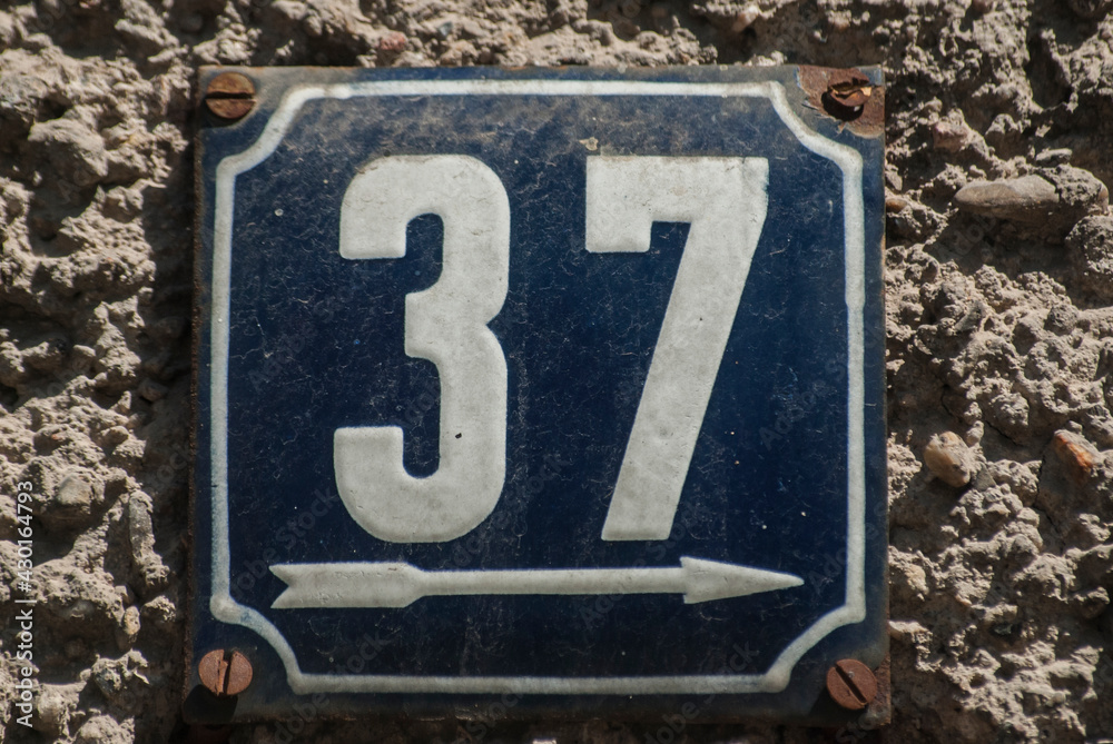 Weathered grunge square metal enamelled plate of number of street address with number 37 Weathered grunge square metal enamelled plate of number of street address with number 37